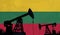 Oil and gas industry background. Oil pump silhouette against lithuania flag. 3D Rendering