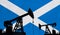 Oil and gas industry background. Oil pump silhouette against scotland flag. 3D Rendering