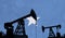 Oil and gas industry background. Oil pump silhouette against somalia flag. 3D Rendering