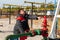 Oil, gas industry. A man near the oil pump. The man controls the process of the oil pump close-up