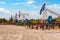 Oil and gas industry in Russia. Oil and gas field bush. Oil pumping chair in the fields of Siberia