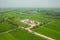 Oil and gas land drilling rig onshore in the middle of a rice field