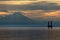 Oil and gas platform in Cook Inlet with snowcapped mountain