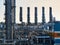 Oil and gas refinery industrial plants with silhouette image. Chemical plant in backlight wuth copyspace selective focus