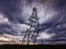 Oil and gas rig profiled on ominous stormy sky