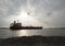 Oil and Gas ship ride across the river with sunset sky as a background.