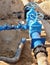 Oil, gas, water industry. Wellhead with valve armature underground. Dug deep trench