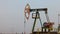 Oil industry, Pumping petroleum Rig in desert. Pump Jack Extracting Crude Oil from a Oil Well. petroleum Industry