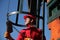 Oil Industry Worker Using Chain Winch.