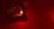 Oil lamp burning with fireworks on red background. Diwali celebration, Deepam festival