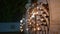 Oil lamps flicker on iron stands in Buddhist temple for Vesak. Peaceful flames up night, wisdom, devotion. Traditional