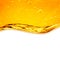 Oil liquid with bubbles. Golden wave on white background