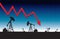 Oil price fall graph illustration on oil pump field at dawn background
