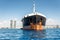 Oil products tanker ship at Akrotiri Bay with Limassol skyline on background. Cyprus