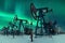 Oil pump - Nodding donkey. Night view. Oil industry equipment. Oil field pump jack and oil refinery in the winter with snow,