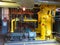 Oil pump, yellow pipes, tubes, machinery at power plant