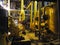 Oil pump, yellow pipes, tubes, machinery at power plant