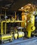 Oil pump, yellow pipes, tubes, machinery at power plant