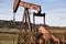 Oil pumping machine. Pump jack. Petroleum extraction. Global warming