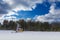 Oil pumpjack winter working. At the sky with clouds. Oil rig energy industrial machine for petroleum in the sunset background for