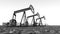 Oil pumps in a landscape in black and white