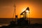 Oil pumps silhouette at colorful sunset