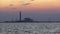 Oil refinery factory in silhouette and sunset sea sky, Thailand.