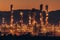 Oil refinery plant for crude oil industry on desert in evening twilight