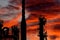 Oil refinery silhouette isolated on red war smoke and fire