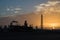 Oil refinery silhouette at sunrise