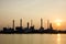 Oil refinery view and freighter with Sunrise