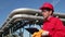 Oil Refinery Worker in Red Overalls