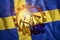 Oil rig on the background of the flag of Sweden. Mixed environment. The concept of oil production, minerals, development of new
