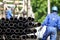 Oil rig drill pipes stacked with oil industry workers in the background. Oil and gas industry. Crude oil pump jack on an oil field