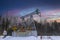 Oil rig energy industrial machine for petroleum in the sunset background for design. Oil pumpjack winter working. Oil pump under