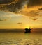 Oil Rig silhouette with majestic ocean and sunset