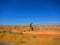 Oil rigs/oil drilling equipment in a field in a california valley