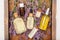 Oil serum oils on lavender flowers in brown wooden box. Lavender essential oil, serum, body butter, massage oil, liquid. Flat lay.