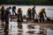 oil spill cleanup crew, removing oil from the water and cleaning of the shoreline