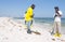 Oil spill workers cleaning beach