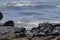 oil spills on the beaches of the pacific ocean with contaminated rocks of repsol company in lima peru in the year 2022