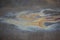 Oil stain on Asphalt, color Gasoline fuel spots on Asphalt Road as Texture or Background