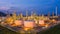 Oil storage tank with oil refinery plant background at twilight, Aerial view oil refinery, refinery plant, refinery factory and