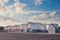 Oil storage tanks terminal on a summer day. Several large barrels of oil