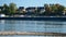 Oil tanker floating on the river with visible ducks and birds. River Rhine in Germany.