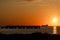 Oil tanker and pier at sunrise