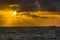 Oil tanker ship at sea on a background of sunset sky