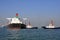 Oil tanker and two tugboats