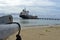 Oil tanker vessel at dock with boat bow in foreground anchor pu