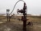 Oil valves and piping. production wellhead. A natural oil well. Horizontal view of a wellhead with valve armature. Oil and gas